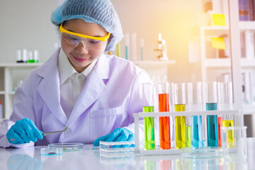 Asia woman scientist working in laboratory.Chemical scientist are doing experiments.She Experiment,chemical,study.Photo concept develop and medicine.