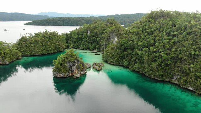 Triton Bay With Turquoise Sea And Green Tropical Trees In Kaimana Islands. Aerial View Of Wide Angle Nature; Pacific Lagoon And Beautiful Landscape In Papua, Indonesia.