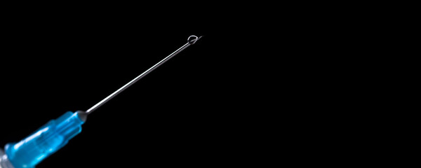 Medical syringe with a needle and vaccine against corona virus.