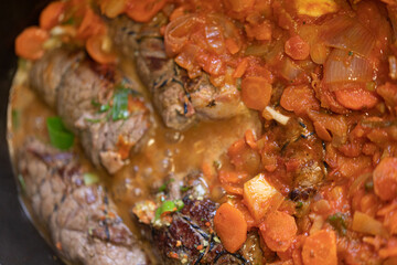 Roasted stuffed pork chop with vegetables.