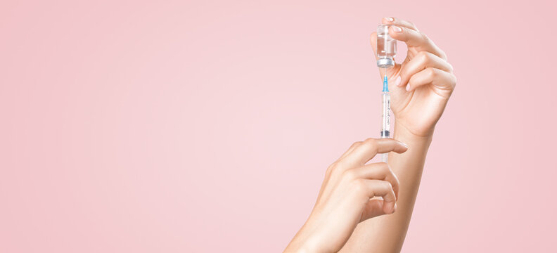 Doctor holding a viol with vaccine against corona virus.