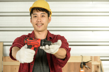 Asian young man carpenter work for customers meticulously He is a young man, a successful...