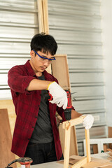 Asian young man carpenter