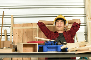 Asian young man carpenter work for customers meticulously He is a young man, a successful...