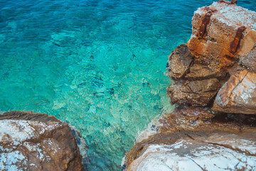 Rocks and the azure sea. Turquoise clear water. - 412934720