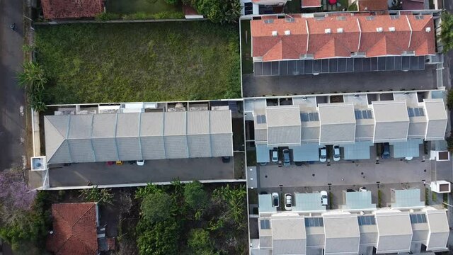 aerial view of a city during the day with houses and buildings