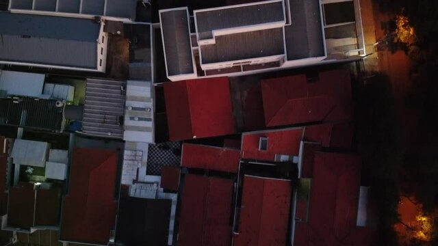 aerial view of a city during the day with houses and buildings
