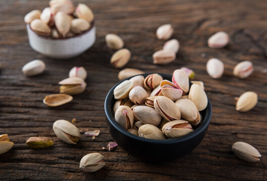 Pistachio in a Bowl on Wooden Background