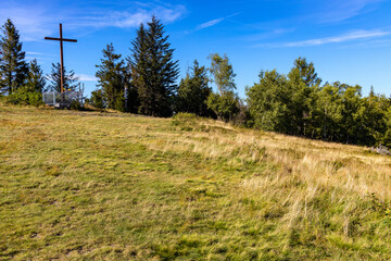 Panoramic view of grassy Leskowiec peak with symbolic cross shrine in Little Beskids near Andrychów in Lesser Poland © Art Media Factory