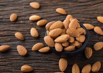 Almond in a Bowl on Wooden Background