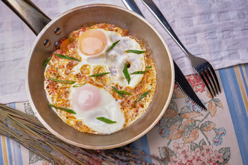 Soft creamy scrambled eggs in cast iron skillet. beauty background.
