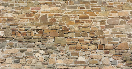 Castle wall made of old stones textures for design and photo background.