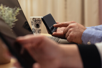 Close up of a man using mobile smart phone
