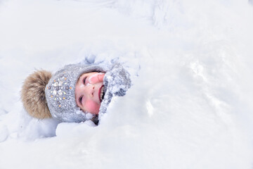 The little girl in the snow. fun, winter, play