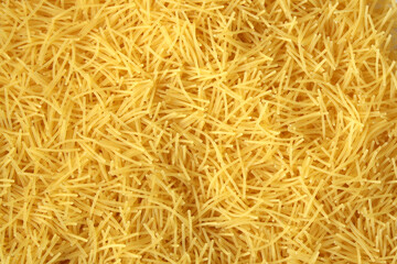 Dry uncooked vermicelli pasta as a background. - obrazy, fototapety, plakaty