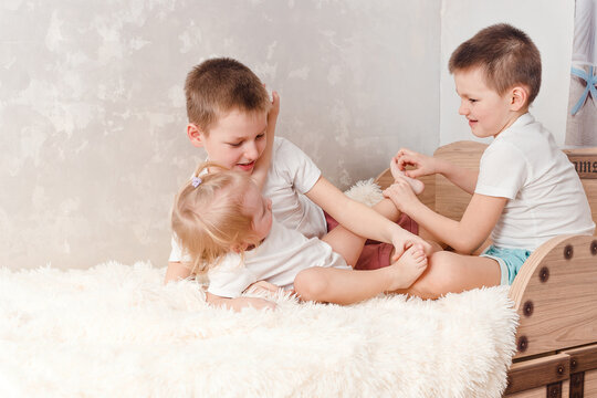 children tickle bare feet