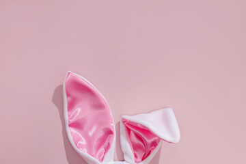 Decorative bunny ears on pink background.