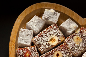 The traditional Turkish dessert Cezerye with hazelnuts. Lokum, Turkish delight.