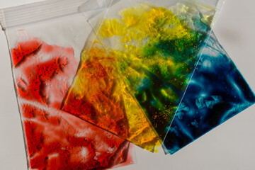 Plastic baggies of colored gel; used to learn about primary colors, color mixing, and sensory play