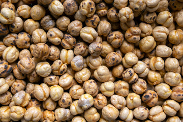  close-up on a pile of roasted chickpeas (greek stragalia ), a superfood that is sold as 
