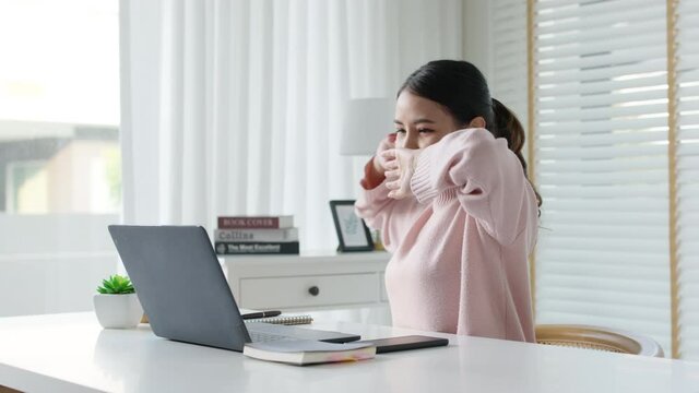 Attractive beautiful young asia female feel tired overworked negative impact health life stretching for break time relax stress relief in concept problem work remotely from home or burnout syndrome.