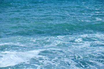 Fototapeta na wymiar waves with foam on the sea surface
