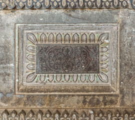 Vijayapura, Karnataka, India - November 8, 2013: Ibrahim Rauza Mausoleum. Closeup of gray stone non-figurative sculpture on wall.
