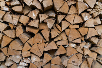 firewood stacked in a woodpile. Aged timber. Pattern