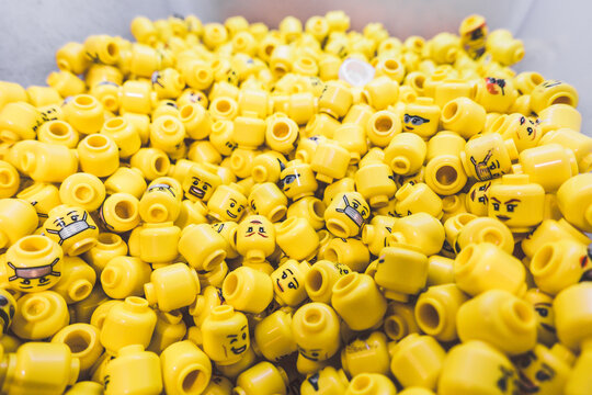 London, England-14 October, 2018: Group of yellow minifigure LEGO heads toy in the Lego Store at Leicester Square London for boy and girl who love LEGO.