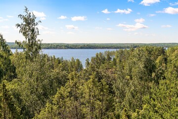 Fototapeta na wymiar Russia, Lake Ladoga, August 2020. The surroundings of the lake from the height of the cliff on the shore.