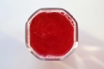 Cranberry drink in a glass. Background.