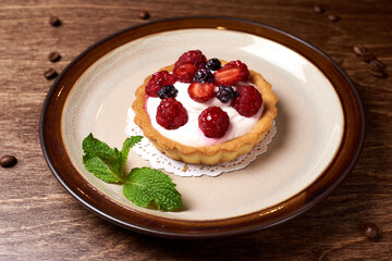 sweet dessert in a round plate on a wooden background