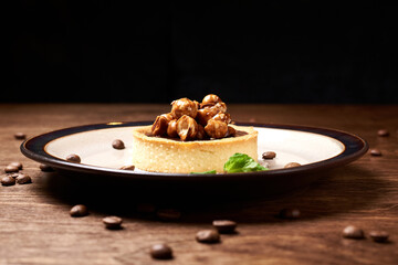 sweet dessert in a round plate on a wooden background