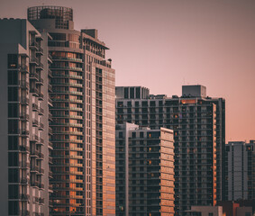 Fototapeta na wymiar skyscrapers in the city sunset reflections glass windows miami midtown 