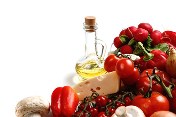 Food cooking background on white wooden table. Fresh vegetables, spices, herbs and oil. Ingredients for cooking with space for your text.
