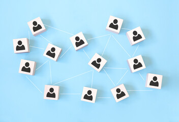 Wooden cube block print screen person icon which link connection network for organisation structure social network and teamwork concept.