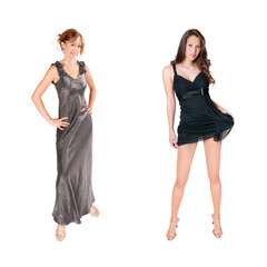 Two beautiful young women wearing elegant evening dresses, isolated in front of white studio background