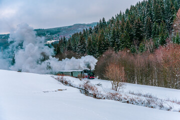 historic steam locomotive in winter, Ore Mountains Germany.