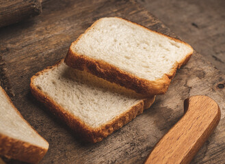 Sliced Bread stock image with wooden background.