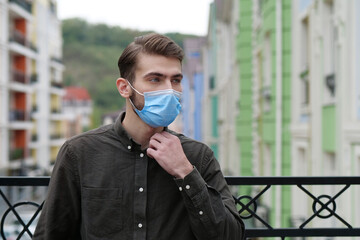 Handsome man in medical protective face mask