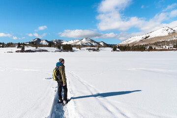 Standing on the edge of Steamboat Lake in Clark, Colorado while snowshoeing 