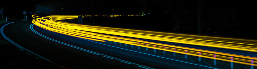 abstract blue and yellow car lights at night