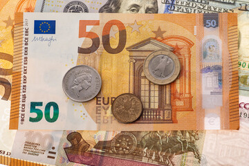 Dollars, euros, rubles and pounds lie on the surface