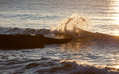 Obraz na płótnie Canvas Sea waves water texture at sunrise