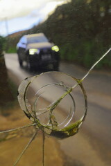 Car on the reflected in broken mirror