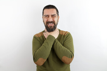 Fototapeta premium Man with beard wearing casual clothes shouting and suffocate because painful strangle. health problem. asphyxiate and suicide concept.