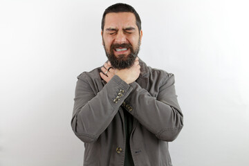 Fototapeta premium Bearded man wearing casual clothes and glasses shouting and suffocate because painful strangle. health problem. asphyxiate and suicide concept.