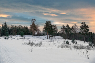 Fototapeta na wymiar Beautiful winter landscape in the mountains. Sunrise. Fantastic winter landscape during sunset.