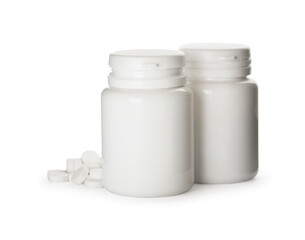 Plastic bottles with pills on white background