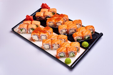 japanese rolls, sushi with sauce, on isolate